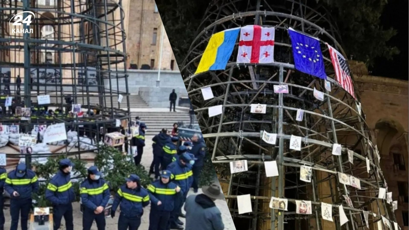 En Tbilisi, los manifestantes decoraron un árbol de Navidad con la bandera de Ucrania