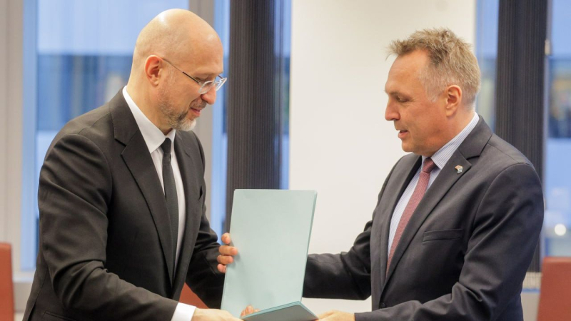 Denis Shmigal y Tore Sandvik
